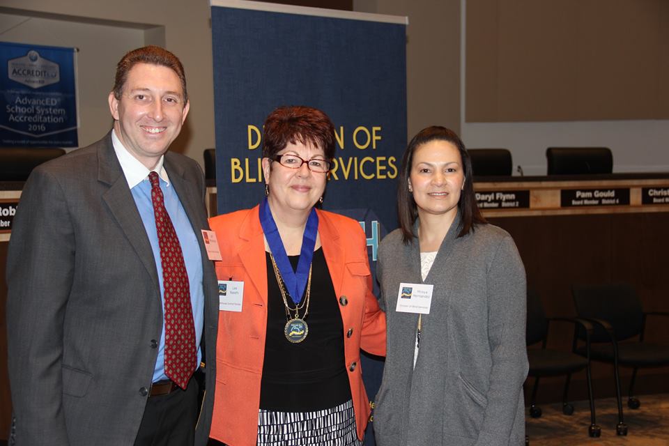 Lee Nasehi accepts Successful 75 Award from DBS administrators Jeff Whitehead and Mireya Hernandez.